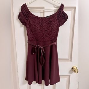 Short maroon dress with satin belt at front lace detailing